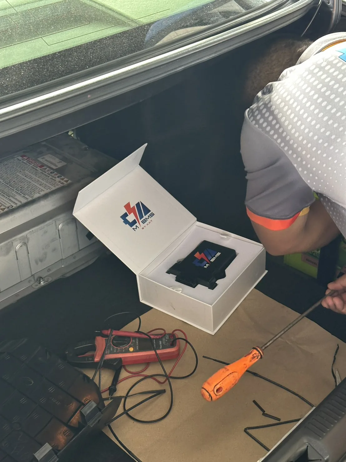 Technician working with M-BMS unit during installation